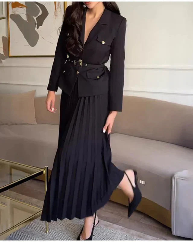 Conjunto Elegante com Casaco Alongado e Saia Plissada – Sofisticação em Dois Tempos